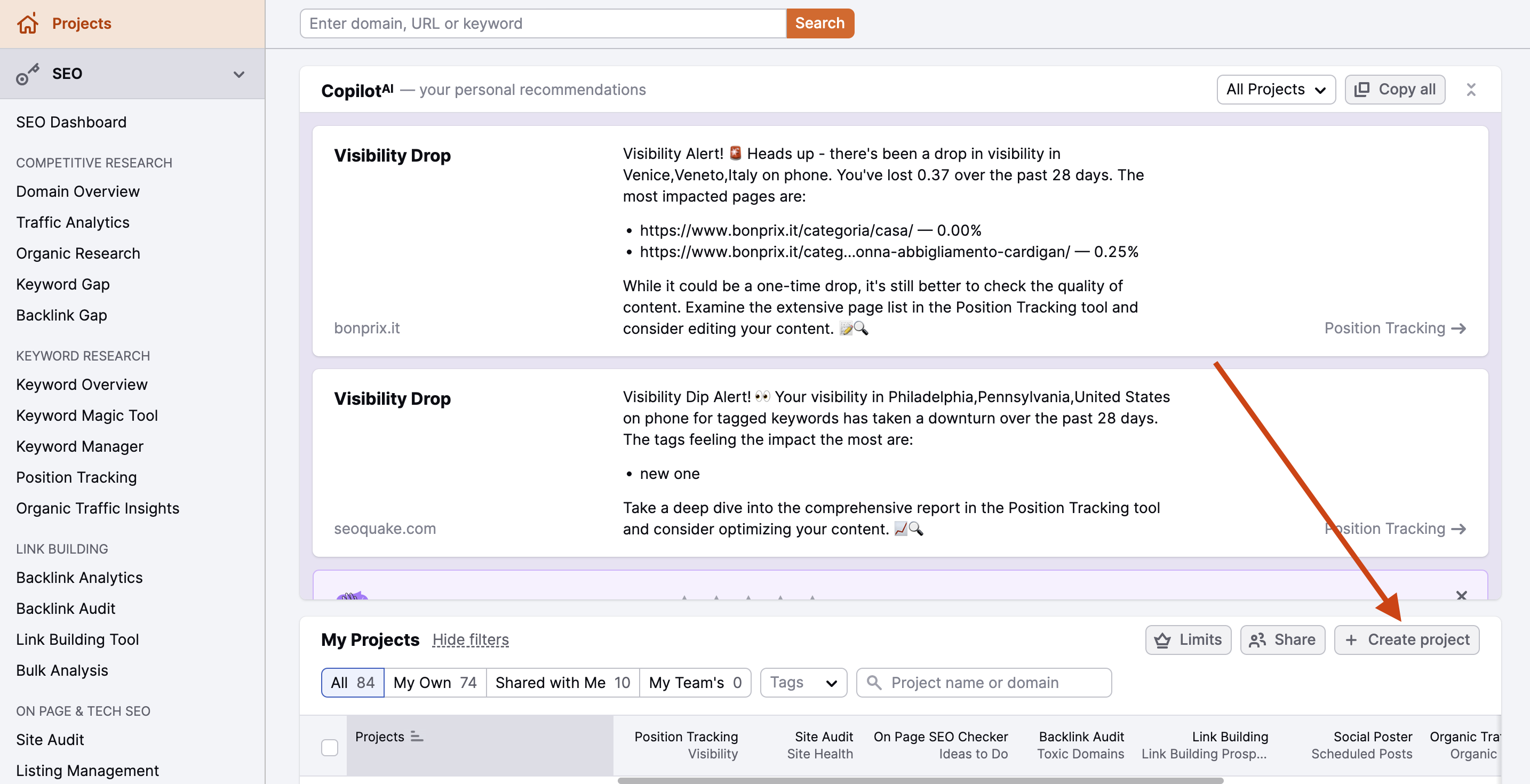 Semrush Projects Dashboard with a red arrow pointing to the Create project button at the top-right of the projects table.